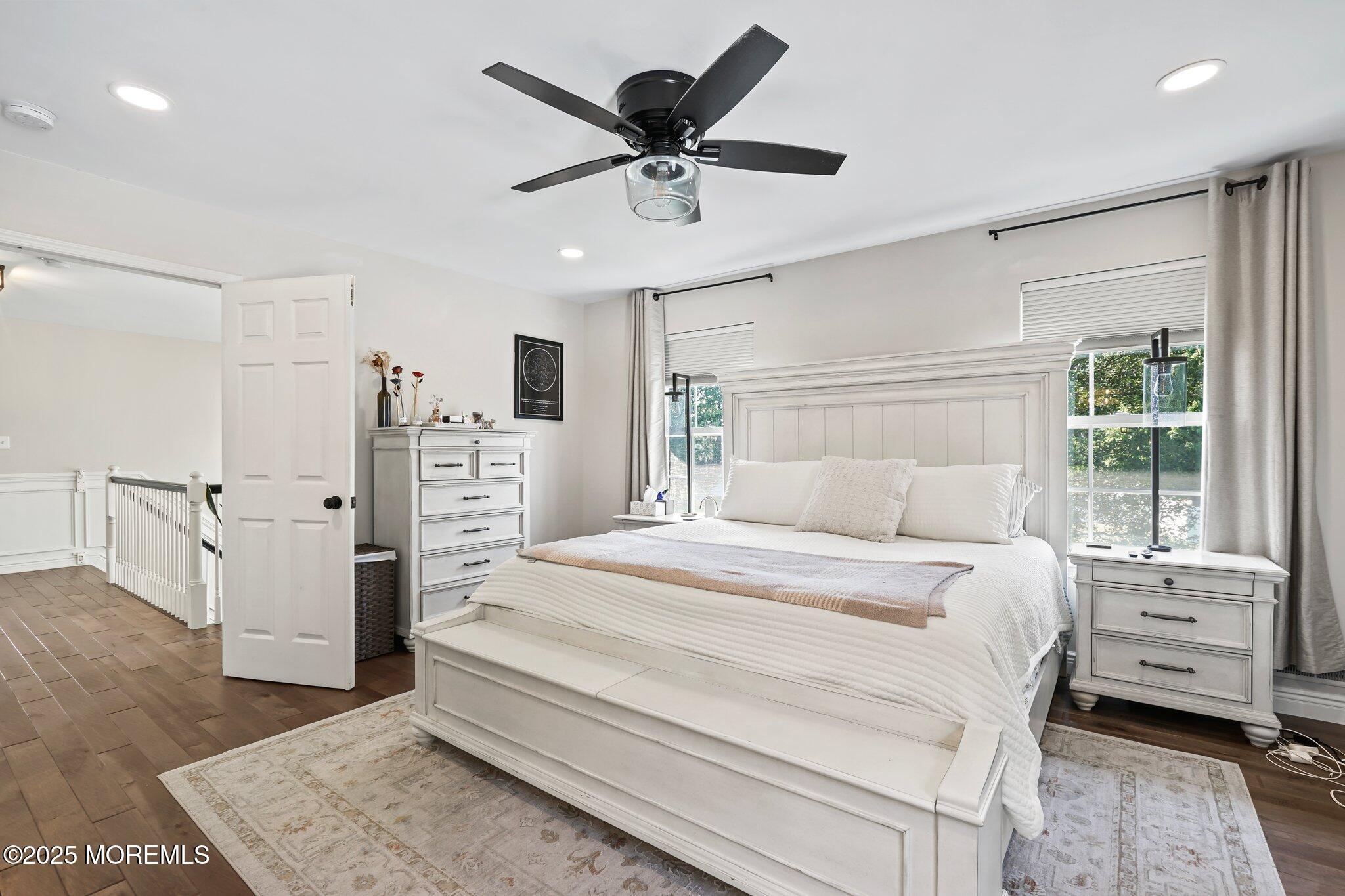 24 Mount Ranier Drive Howell, NJ 07731 - Photo 30 of 53 a bedroom with a bed and a dresser with wooden floor