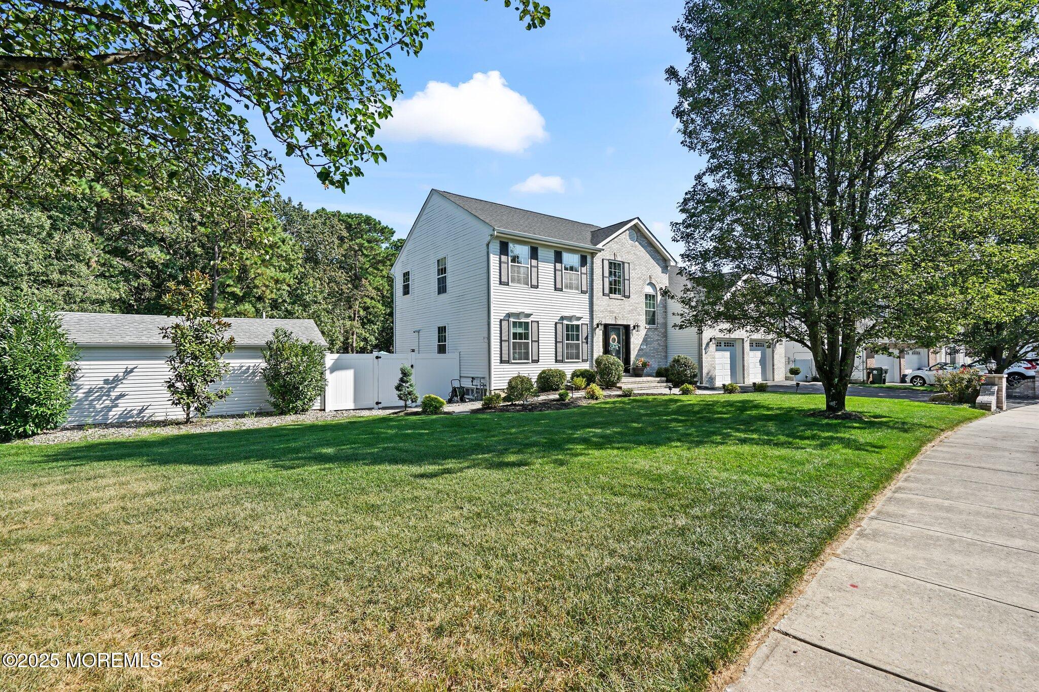 24 Mount Ranier Drive Howell, NJ 07731 - Photo 3 of 53 front view of a house with a yard