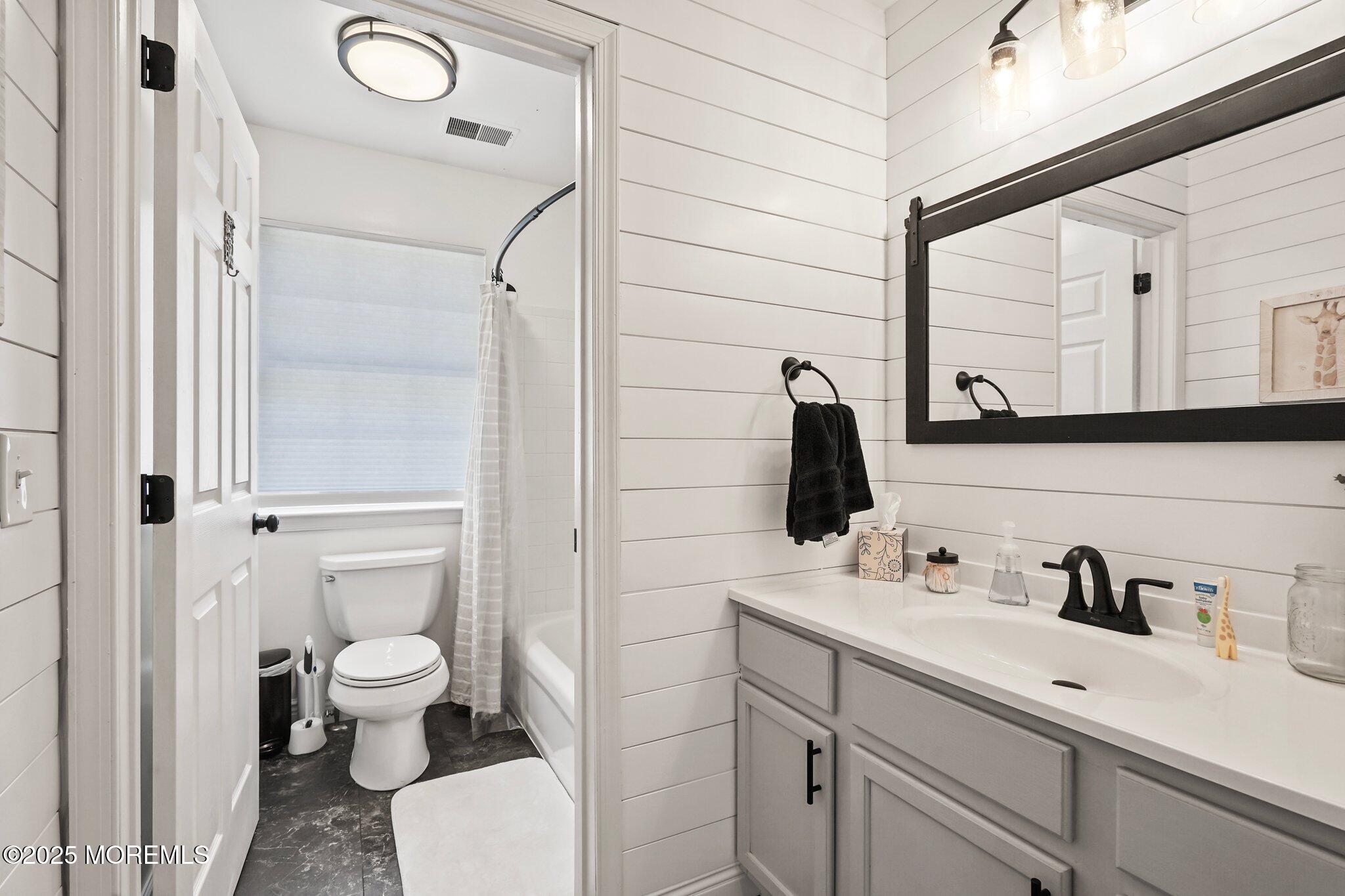 24 Mount Ranier Drive Howell, NJ 07731 - Photo 34 of 53 a bathroom with a sink a toilet and a mirror