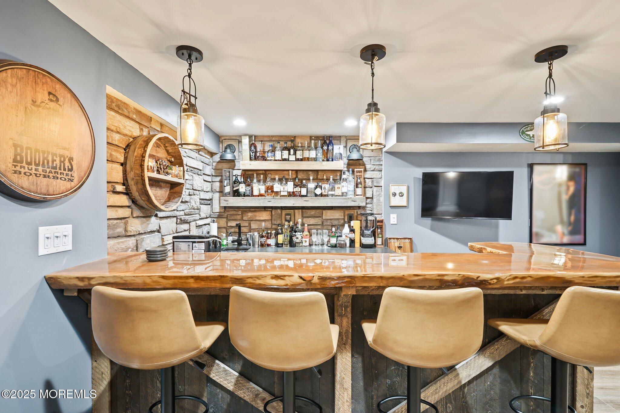 24 Mount Ranier Drive Howell, NJ 07731 - Photo 39 of 53 a dining room with furniture and a chandelier