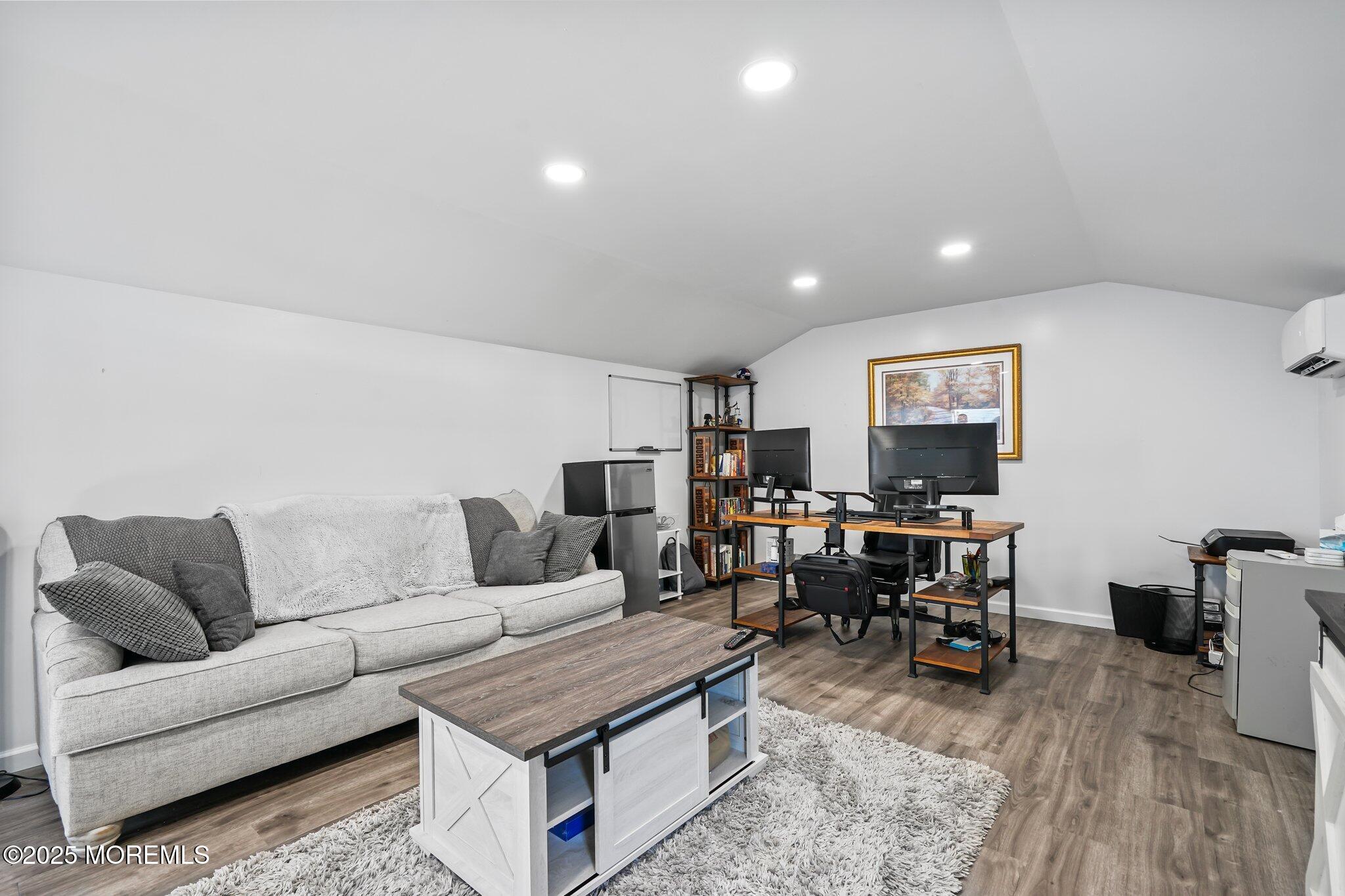 24 Mount Ranier Drive Howell, NJ 07731 - Photo 50 of 53 a living room with furniture and a flat screen tv