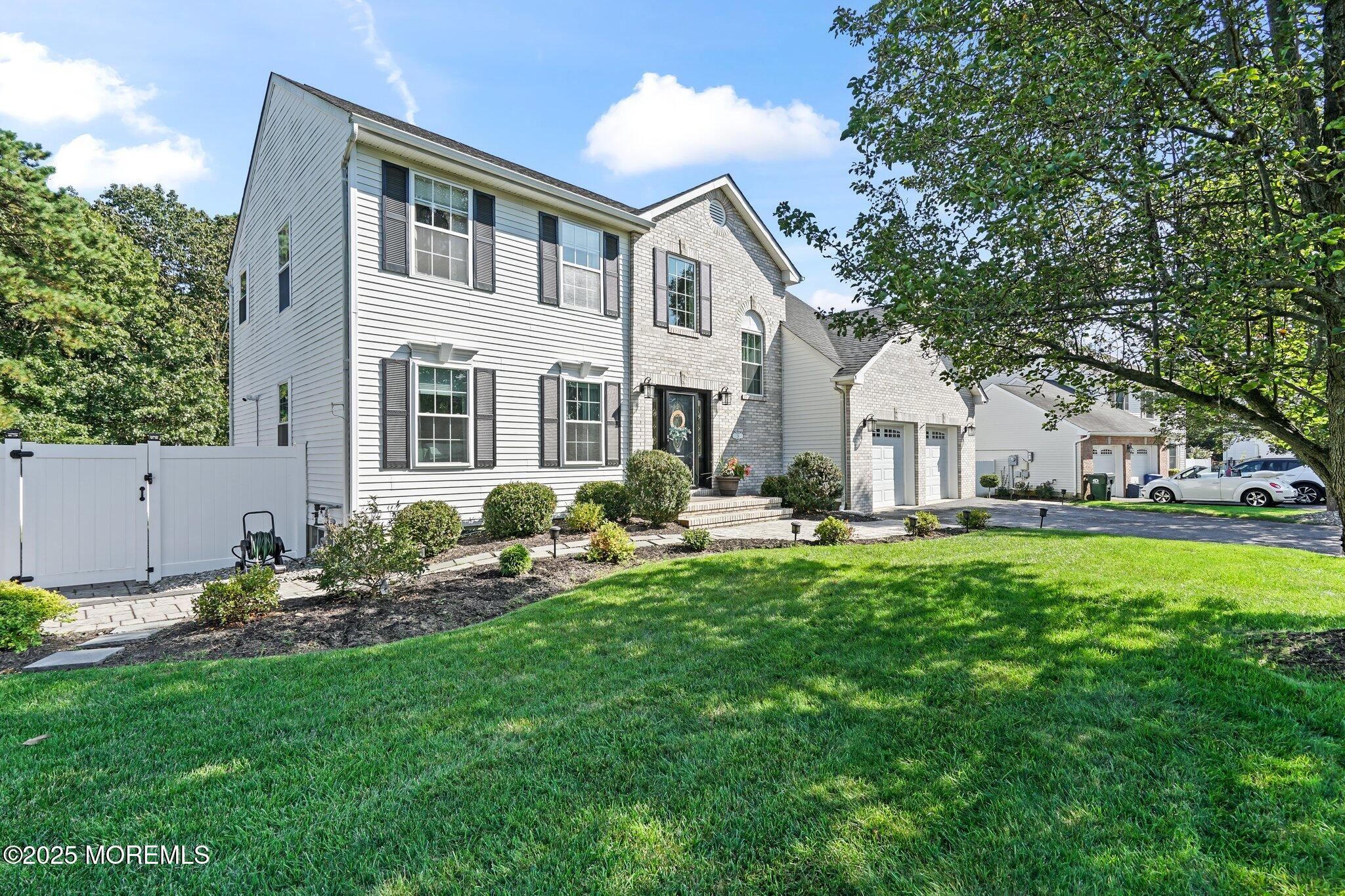 24 Mount Ranier Drive Howell, NJ 07731 - Photo 6 of 53 a front view of a house with a garden