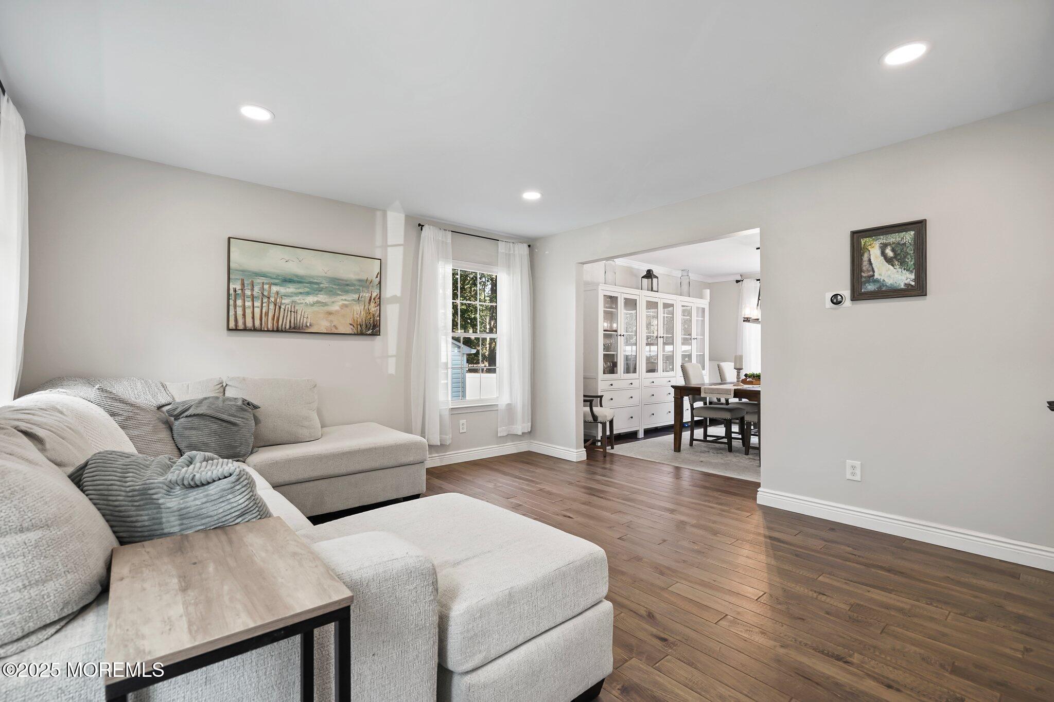 24 Mount Ranier Drive Howell, NJ 07731 - Photo 7 of 53 a living room with furniture and wooden floor