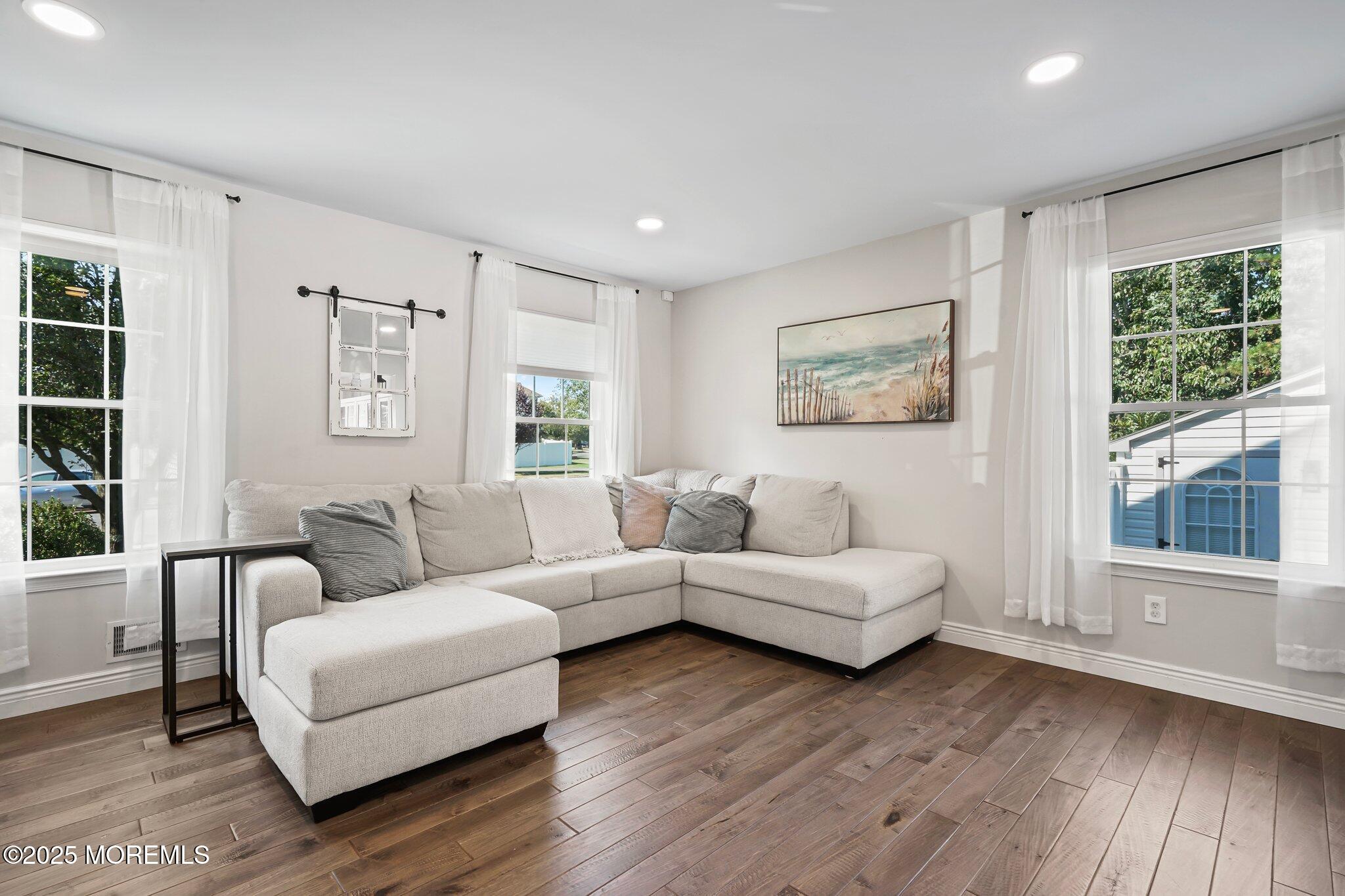 24 Mount Ranier Drive Howell, NJ 07731 - Photo 8 of 53 a living room with furniture and a large window