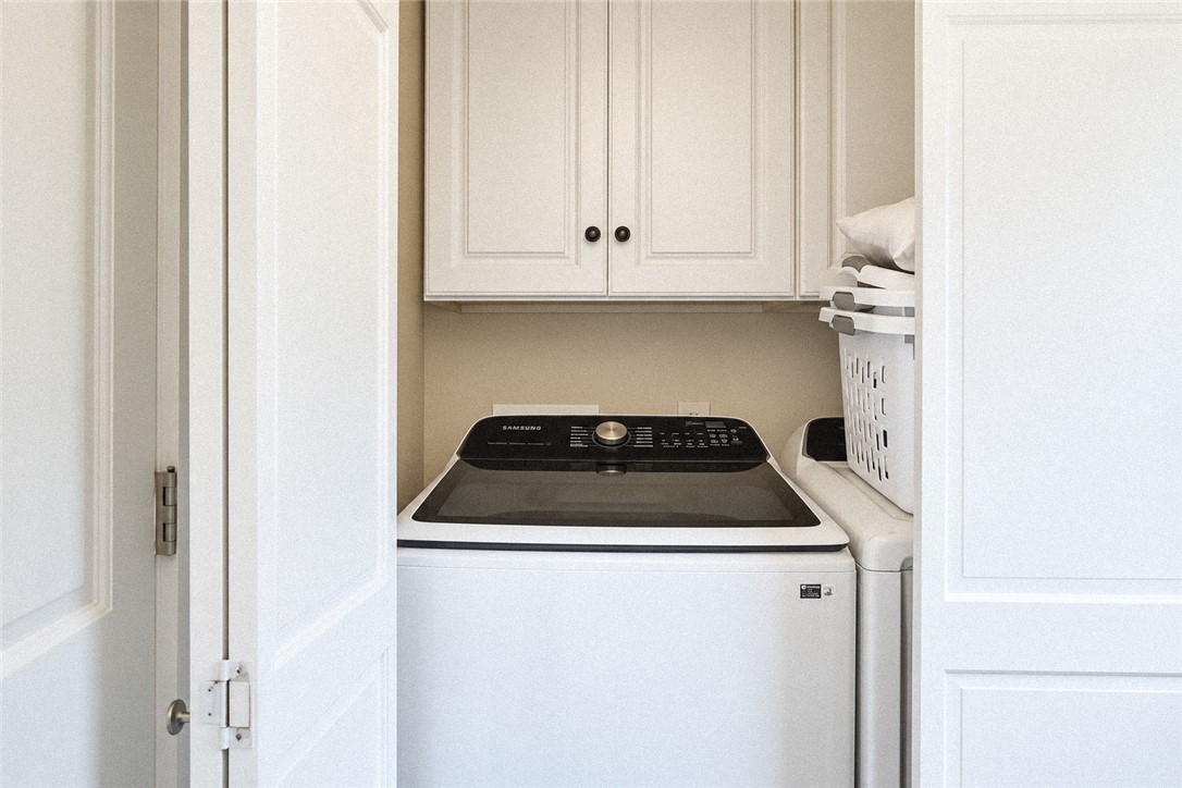2420 Rainey Road Starr, SC 29684 - Photo 22 of 36 A convenient laundry closet features overhead cabinetry for organized storage.