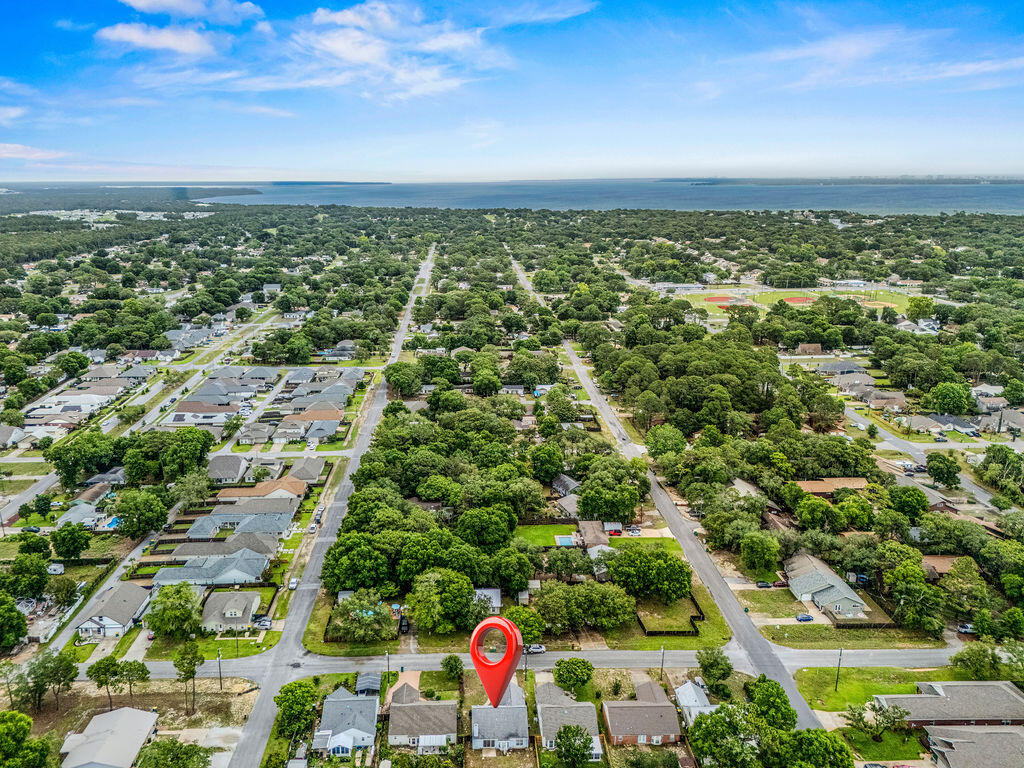 53 4th Street Shalimar, FL 32579 - Photo 44 of 47 an aerial view of residential houses with outdoor space and trees