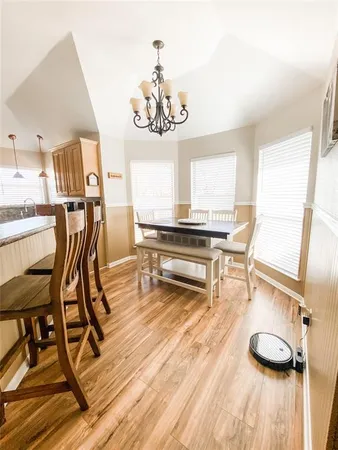 a view of a dining room with furniture and a table