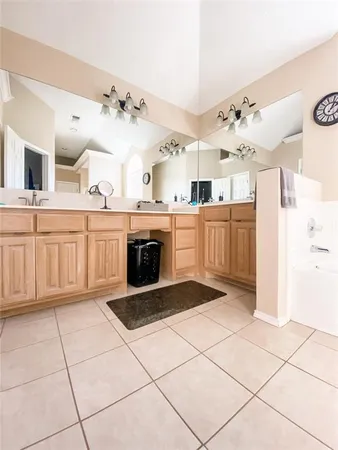 a kitchen with cabinets and appliances