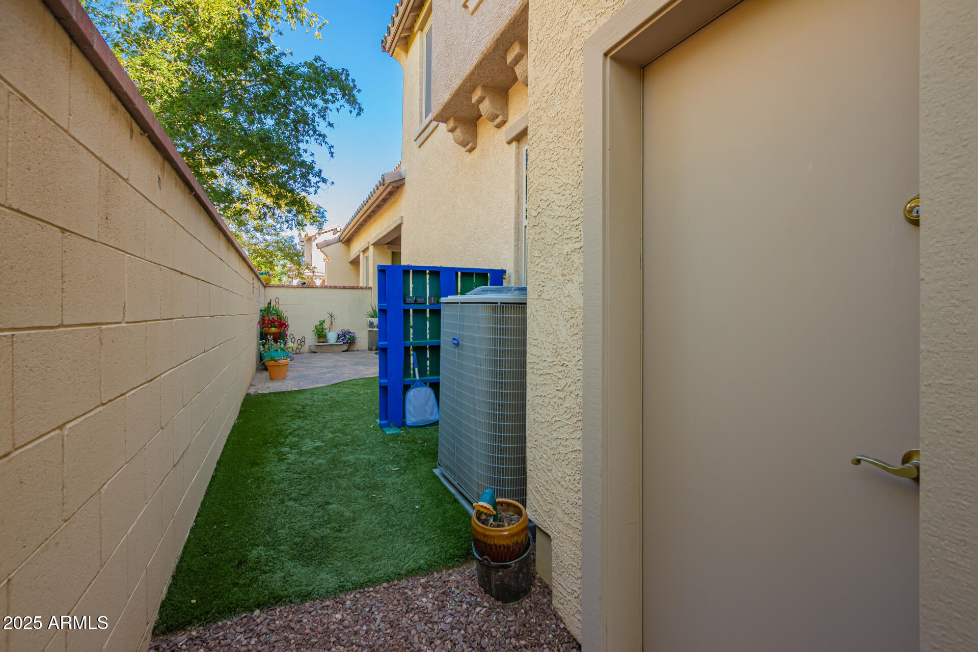 20977 West Hamilton Street Buckeye, AZ 85396 - Photo 41 of 53 Side patio with turf