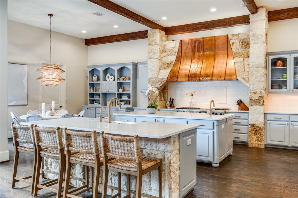 4906 Purdue Avenue Dallas, TX 75209 - Photo 1 of 1 a kitchen with a stove a sink and a refrigerator