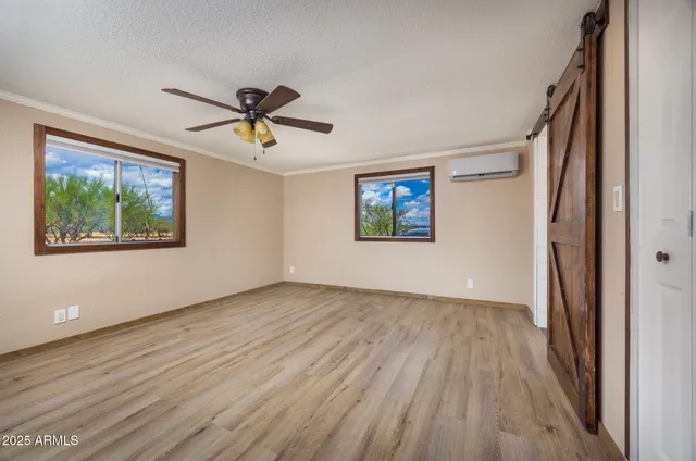 wooden floor in an empty room with a window