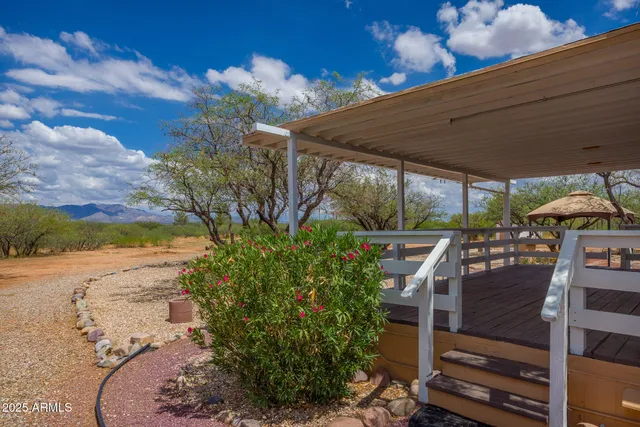 a view of a backyard with sitting area