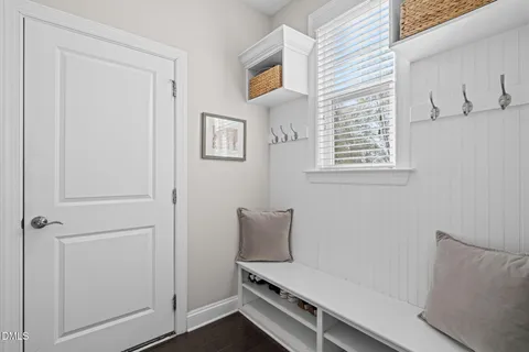 a view of room with window and wooden floor