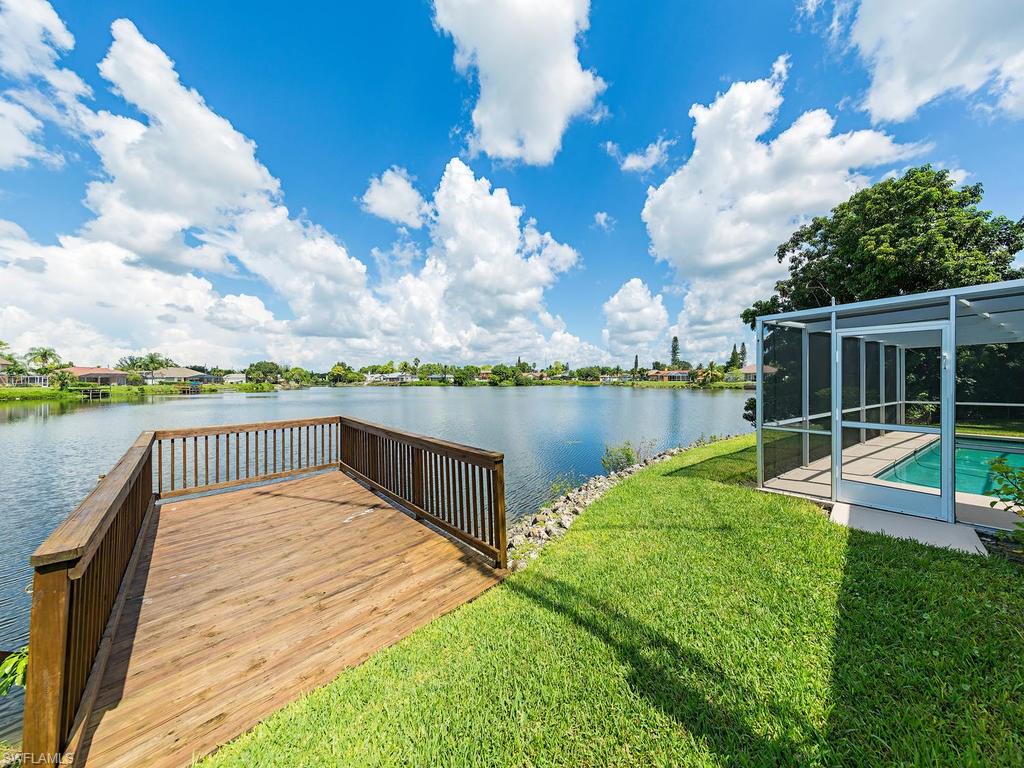 3065 50th Lane Southwest Naples, FL 34116 - Photo 1 of 25 a view of a lake with a garden