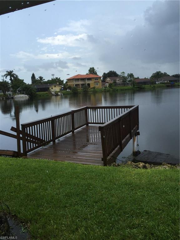 3065 50th Lane Southwest Naples, FL 34116 - Photo 16 of 25 a view of a deck with a garden
