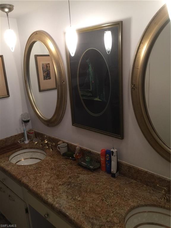 3065 50th Lane Southwest Naples, FL 34116 - Photo 20 of 25 a bathroom with a double vanity sink and a mirror