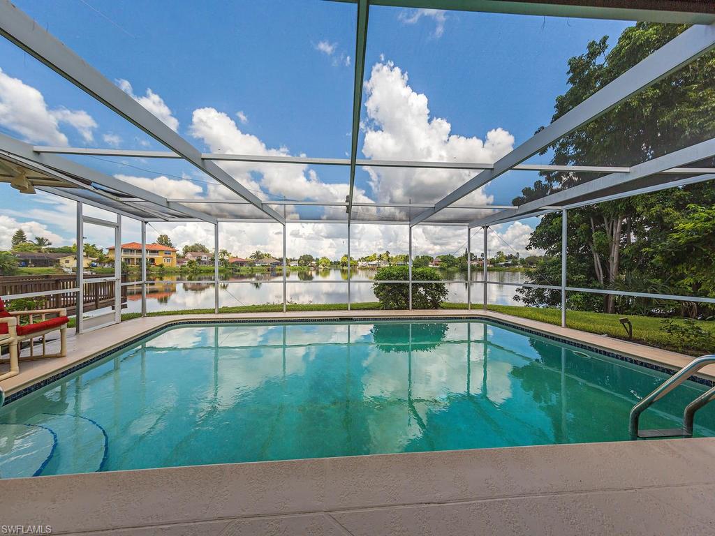 3065 50th Lane Southwest Naples, FL 34116 - Photo 2 of 25 a view of a swimming pool and outdoor space