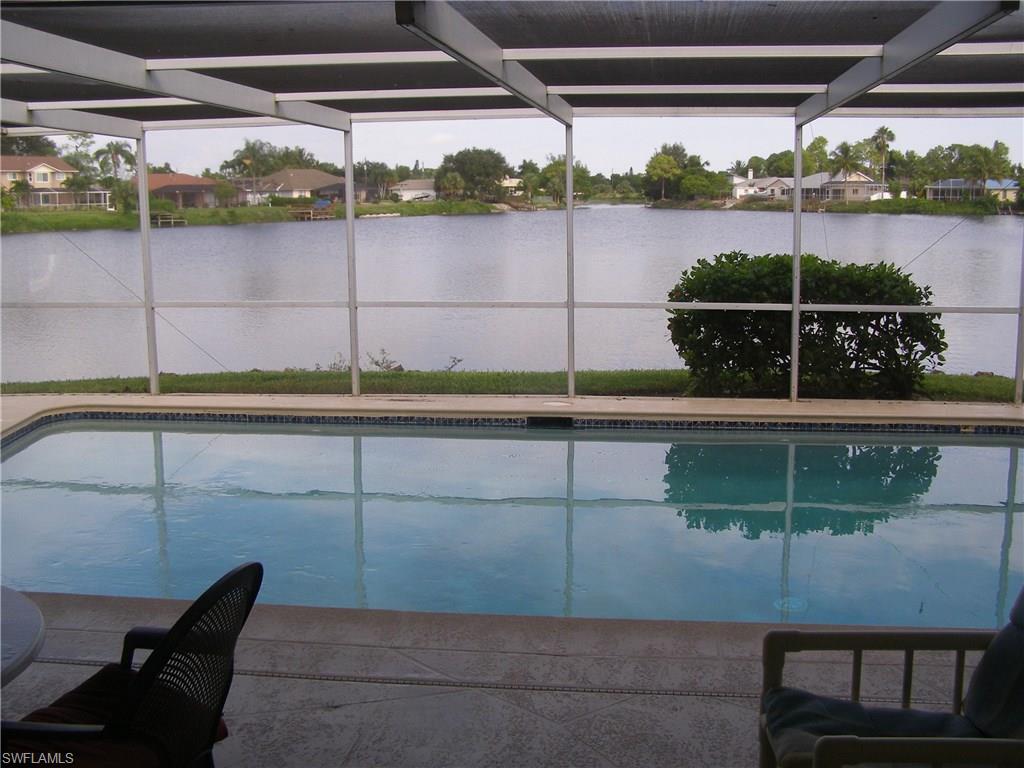 3065 50th Lane Southwest Naples, FL 34116 - Photo 23 of 25 a view of a yard from a balcony