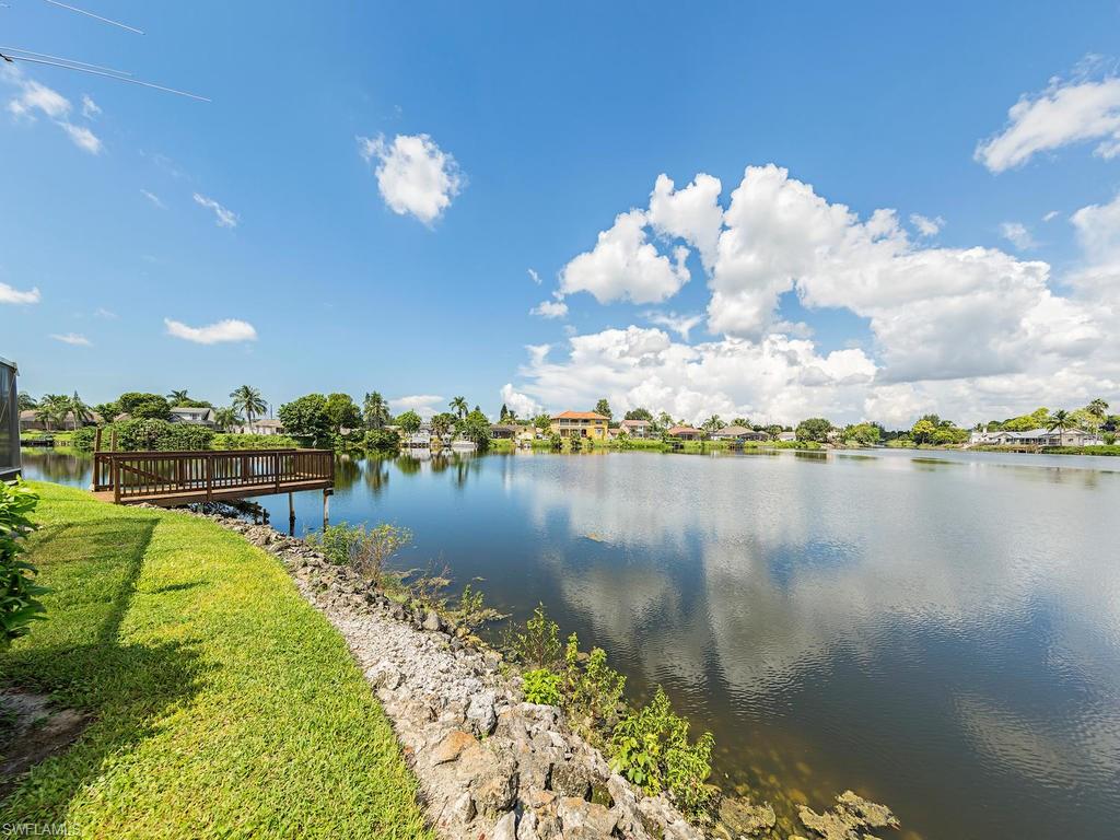 3065 50th Lane Southwest Naples, FL 34116 - Photo 3 of 25 a view of a lake in middle of the city