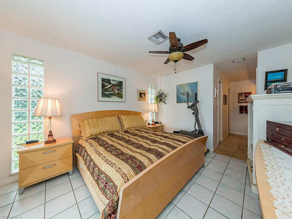 3065 50th Lane Southwest Naples, FL 34116 - Photo 6 of 25 a kitchen with a stove and a refrigerator