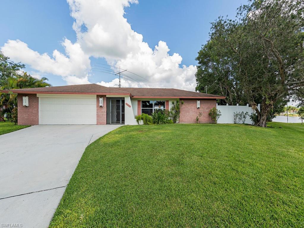 3065 50th Lane Southwest Naples, FL 34116 - Photo 9 of 25 a front view of house with yard and green space