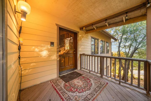 a view of a porch with wooden floor