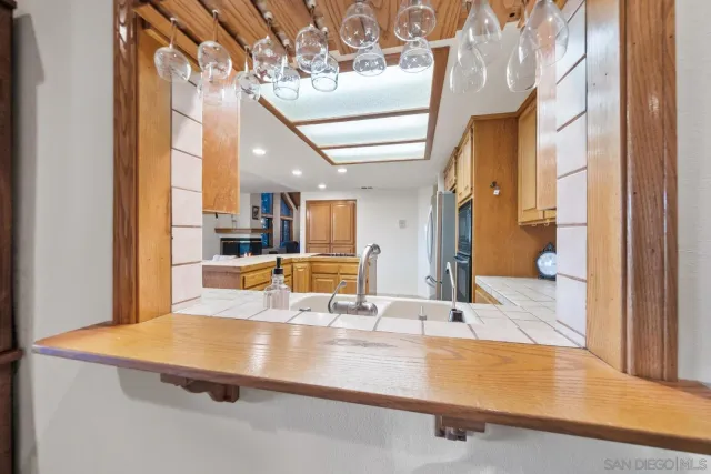a view of a living room with a sink and chandelier