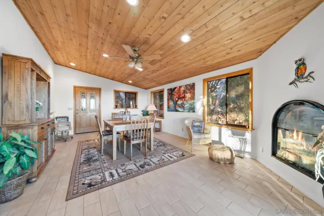 a spacious bedroom with a bed and a chandelier