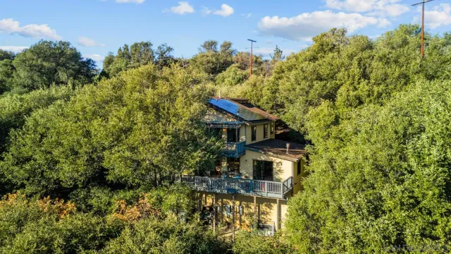 a view of a field with mountains in the background