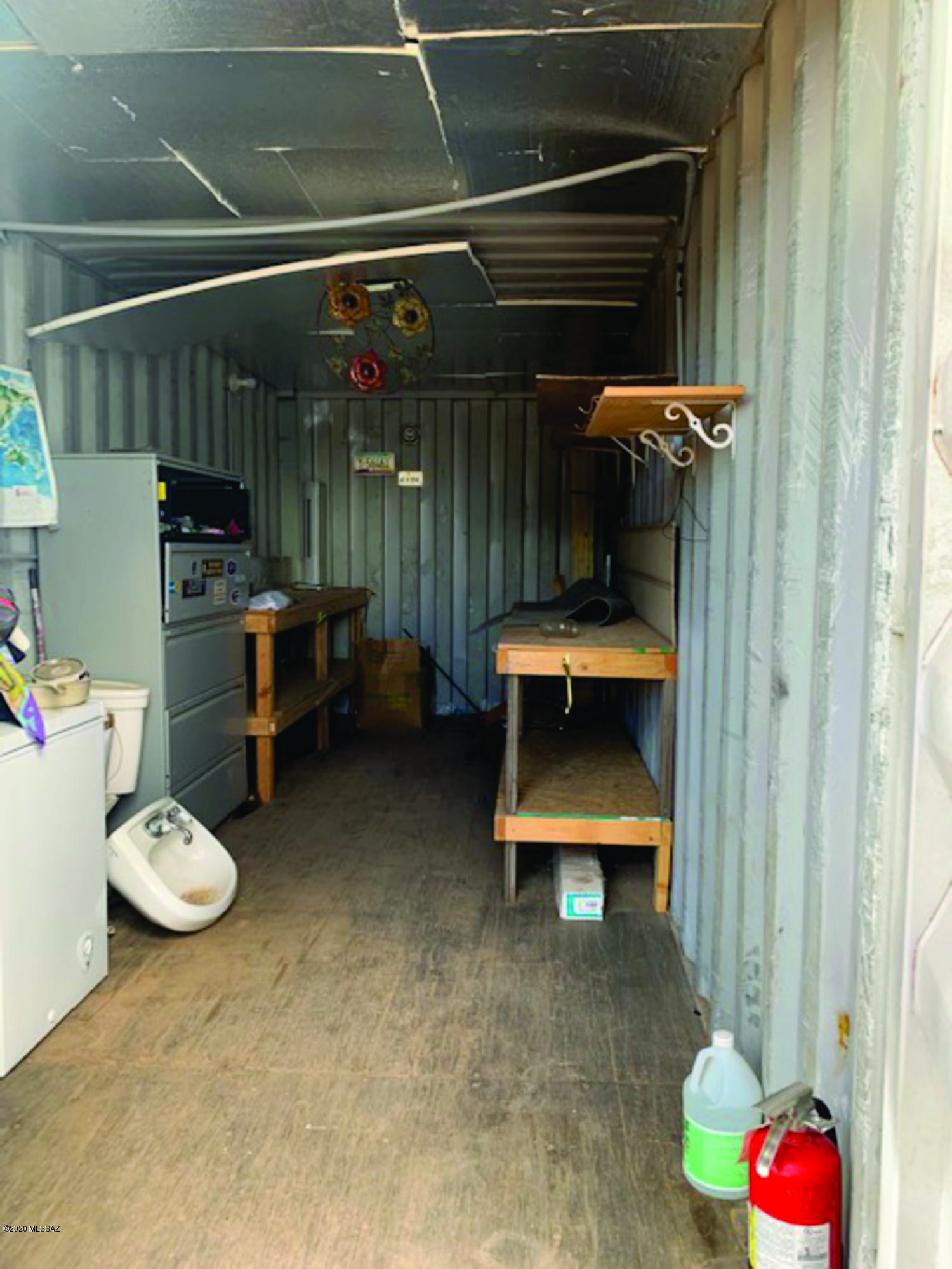 15580 West Hardscrabble Road Arivaca, AZ 85601 - Photo 13 of 14 a view of storage and utility room with racks empty shelves