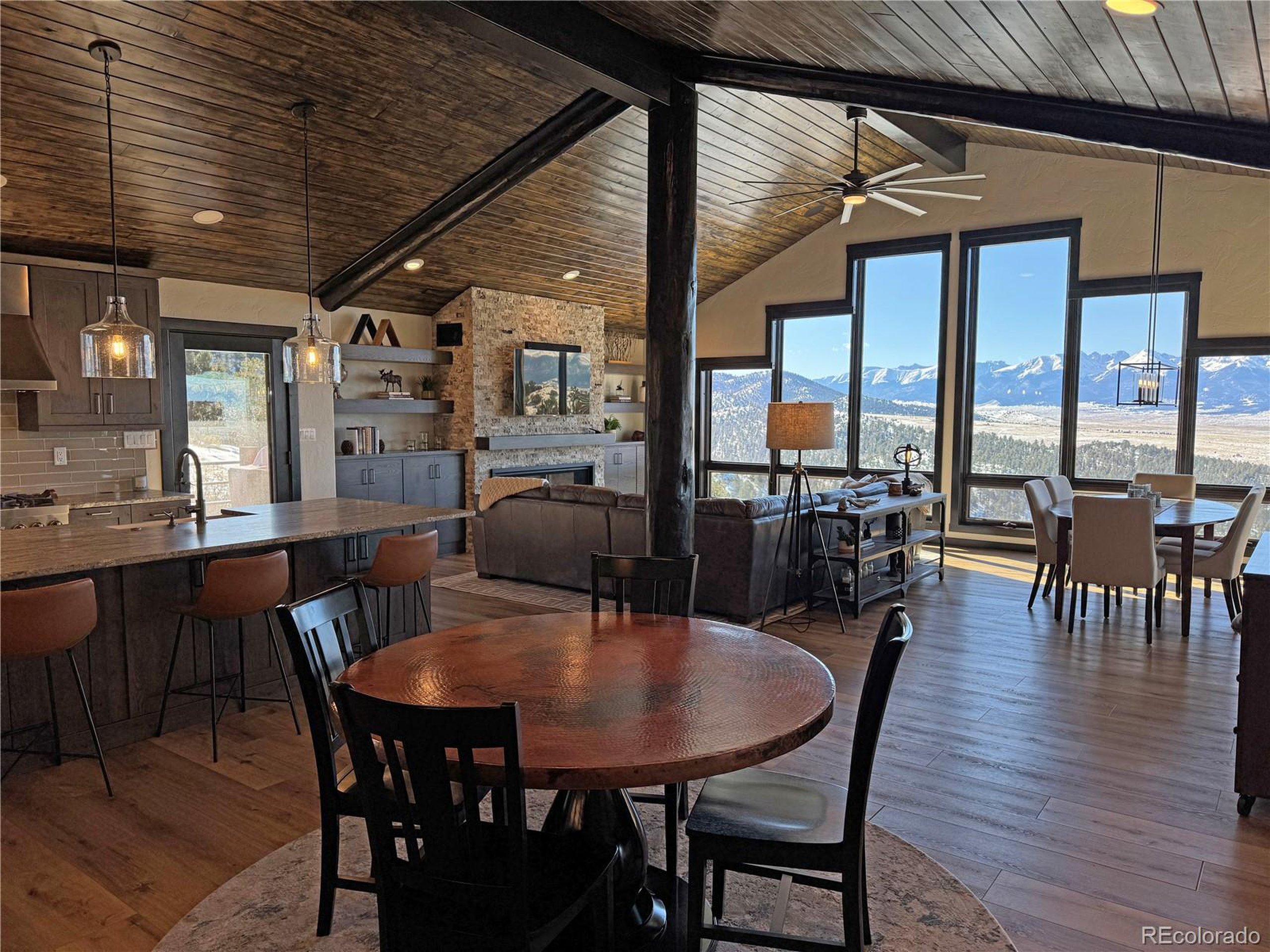 680 Ridge Road Westcliffe, CO 81252 - Photo 13 of 46 a view of a dining room with furniture window and wooden floor