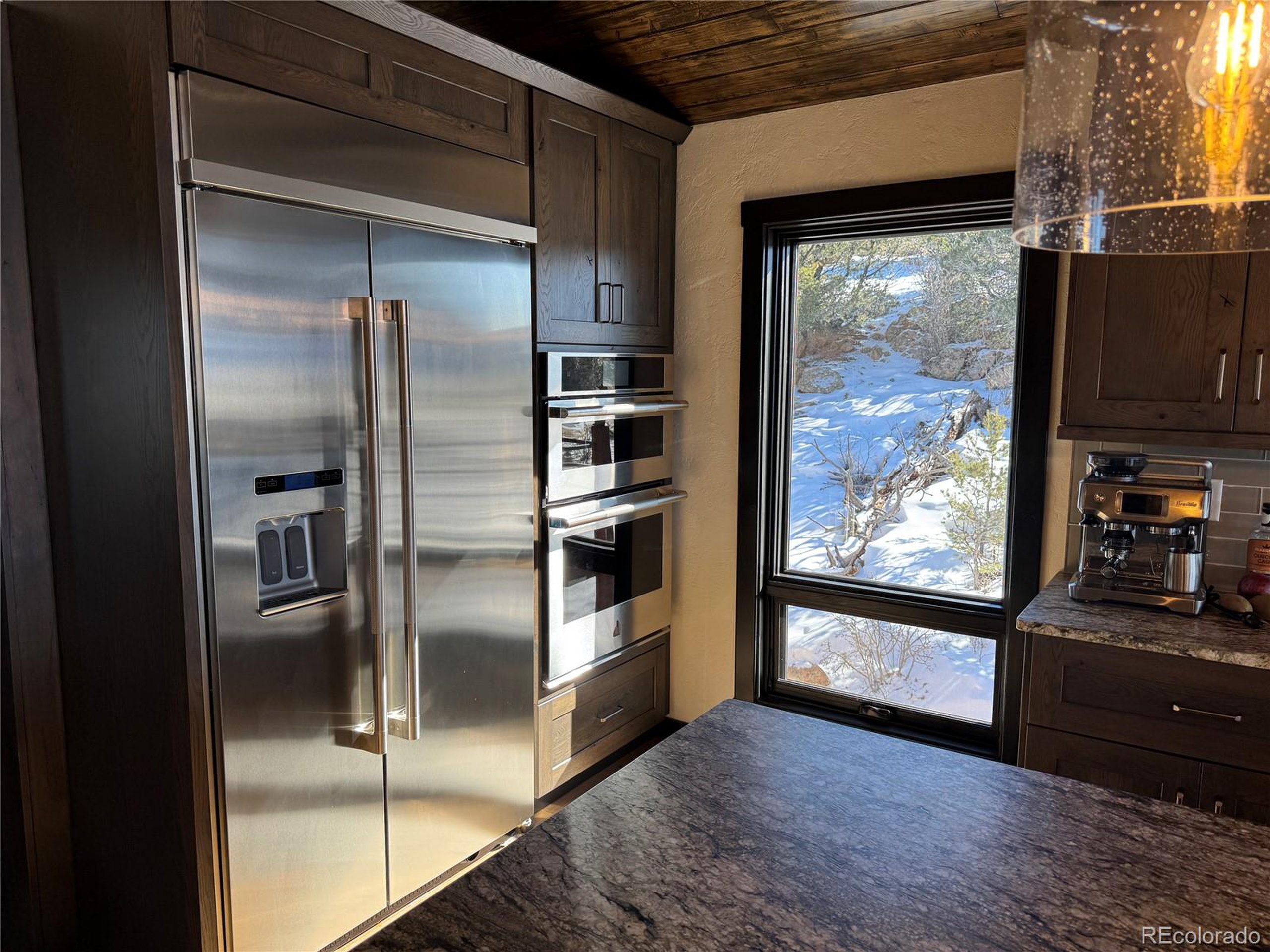 680 Ridge Road Westcliffe, CO 81252 - Photo 17 of 46 a kitchen with stainless steel appliances a refrigerator and a window