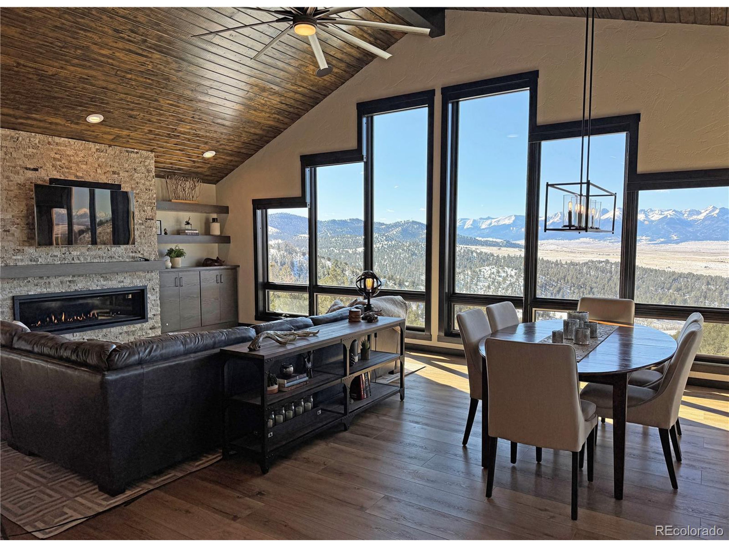 680 Ridge Road Westcliffe, CO 81252 - Photo 29 of 46 a dining hall with stainless steel appliances granite countertop a stove kitchen island a dining table and chairs
