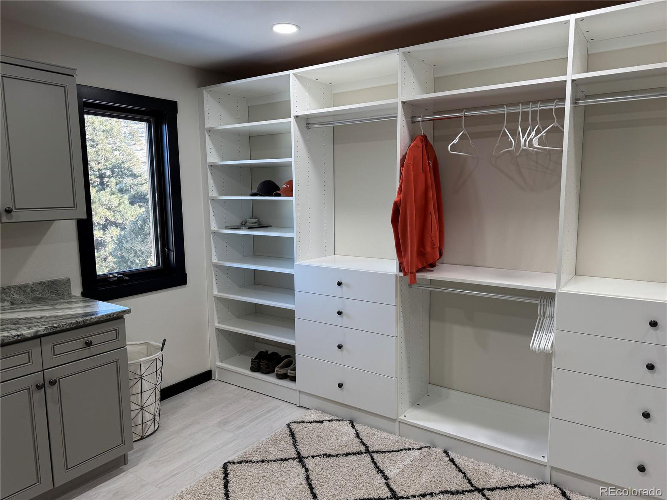 680 Ridge Road Westcliffe, CO 81252 - Photo 31 of 46 a view of walk in closet with clothes and shoes