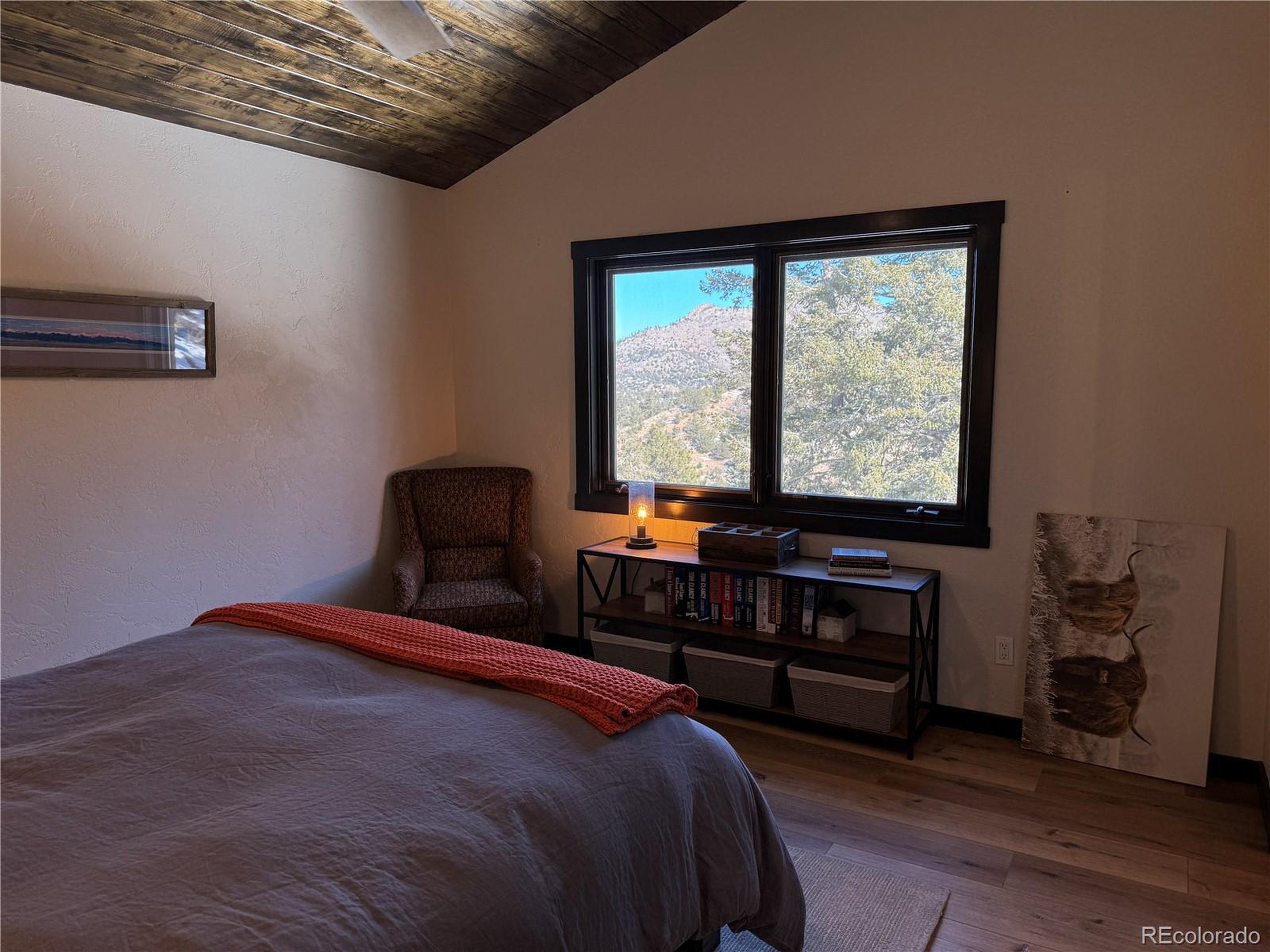 680 Ridge Road Westcliffe, CO 81252 - Photo 33 of 46 a bedroom with a bed and a window