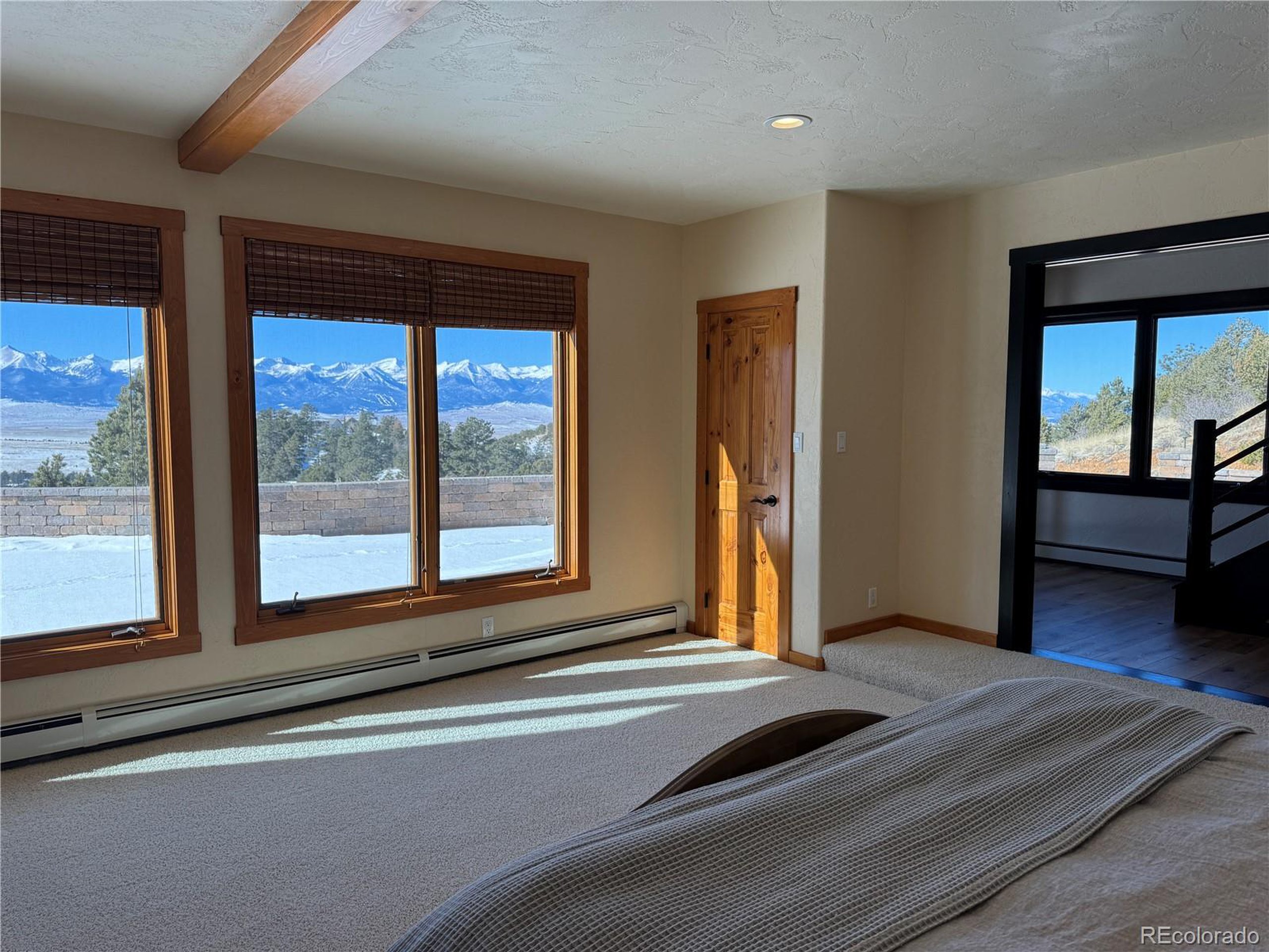 680 Ridge Road Westcliffe, CO 81252 - Photo 37 of 46 a view of a livingroom with wooden floor and a large window