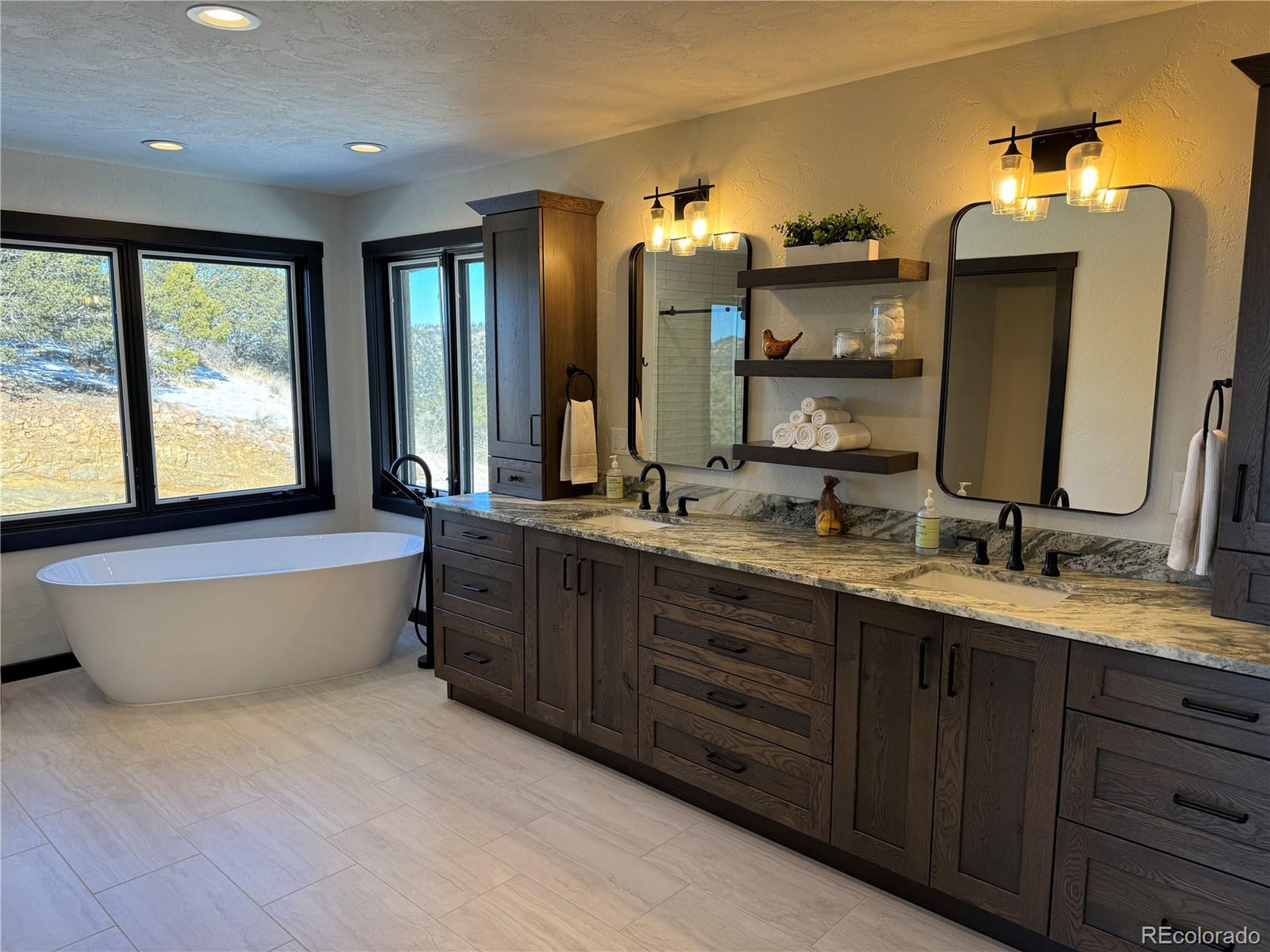680 Ridge Road Westcliffe, CO 81252 - Photo 6 of 46 a bathroom with a double vanity sink and a mirror