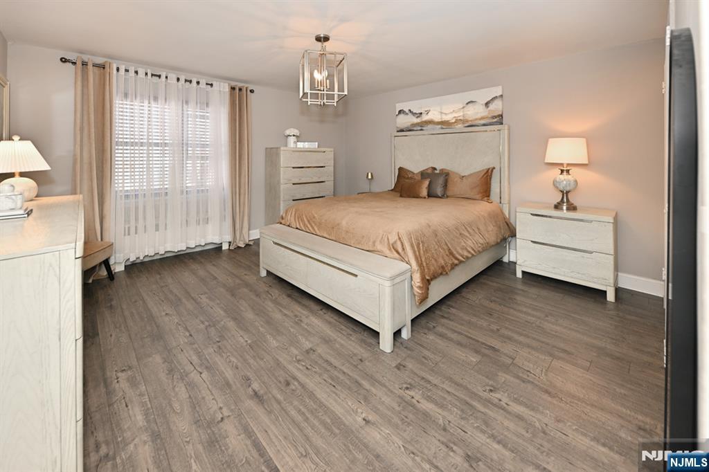 483 Colonial Terrace, Unit 9 Hackensack, NJ 07601 - Photo 13 of 25 a bedroom with a large bed and a window