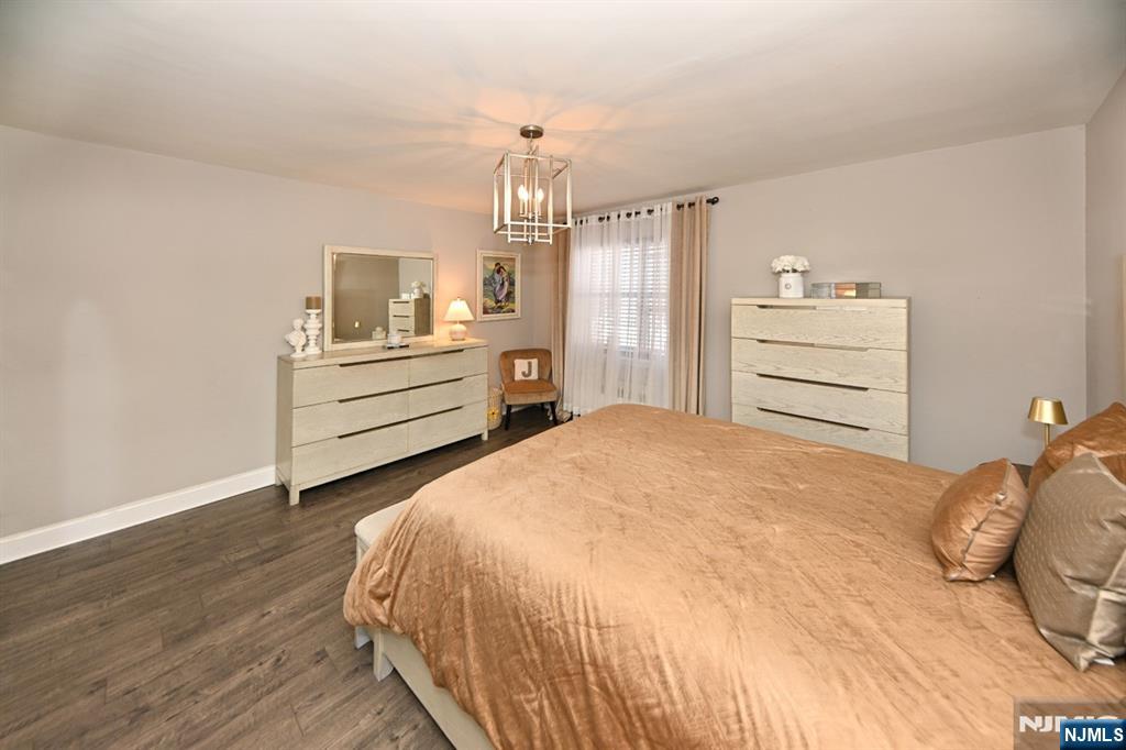 483 Colonial Terrace, Unit 9 Hackensack, NJ 07601 - Photo 15 of 25 a bedroom with a bed and cabinet
