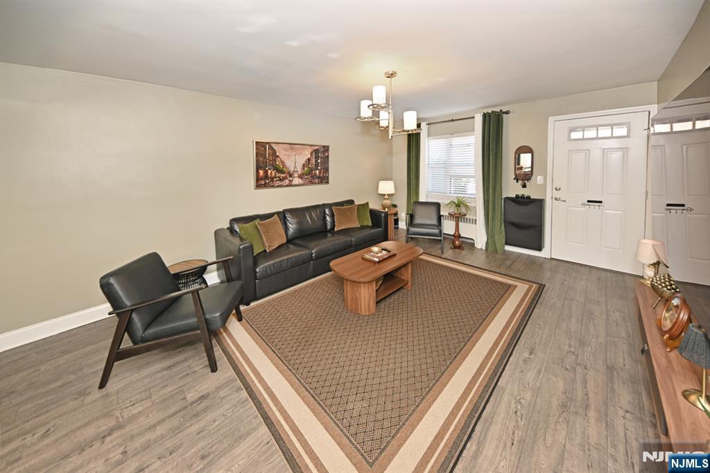 483 Colonial Terrace, Unit 9 Hackensack, NJ 07601 - Photo 2 of 25 a living room with furniture rug and wooden floor