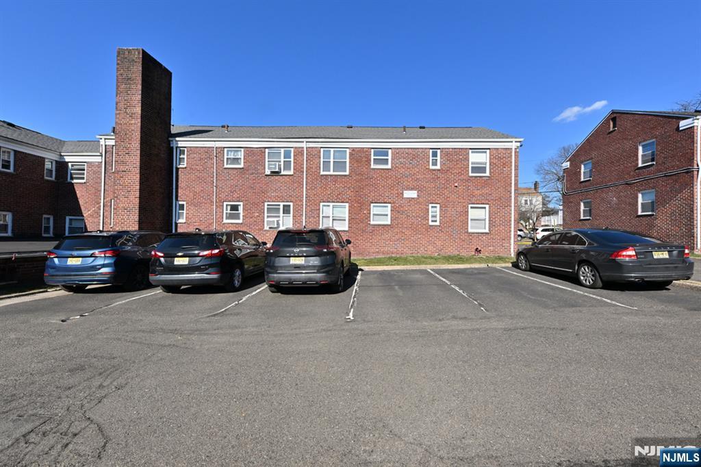 483 Colonial Terrace, Unit 9 Hackensack, NJ 07601 - Photo 21 of 25 a view of building with cars parked in front of it