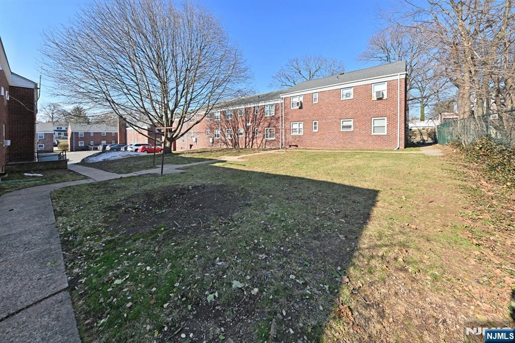 483 Colonial Terrace, Unit 9 Hackensack, NJ 07601 - Photo 22 of 25 a view of a big yard with large tree