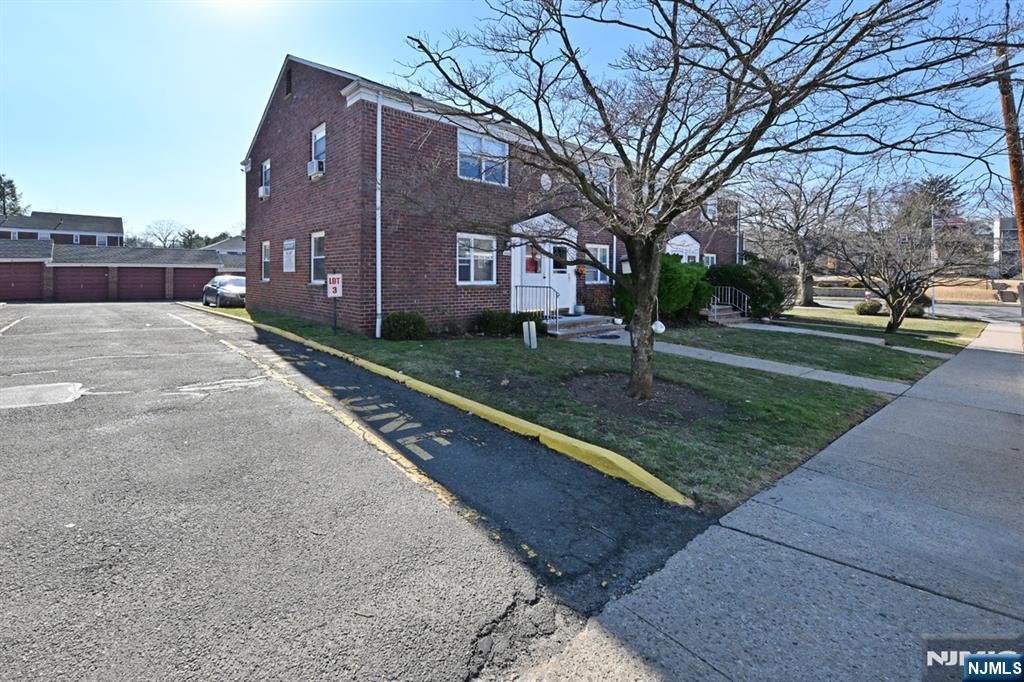 483 Colonial Terrace, Unit 9 Hackensack, NJ 07601 - Photo 23 of 25 a view of a house with a yard