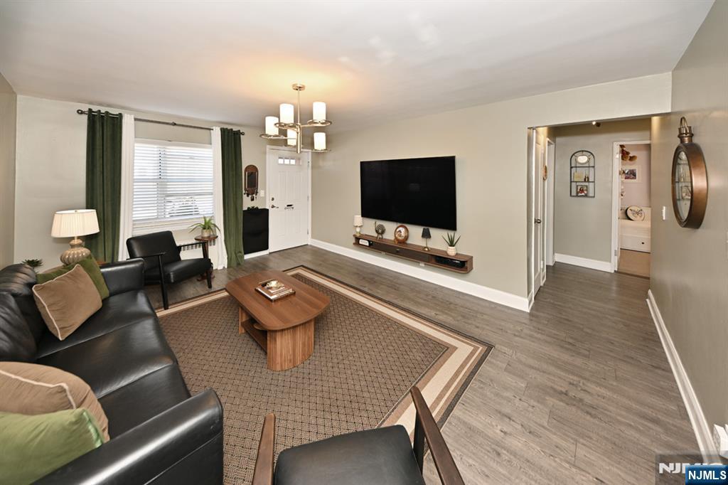 483 Colonial Terrace, Unit 9 Hackensack, NJ 07601 - Photo 3 of 25 a living room with furniture and a flat screen tv
