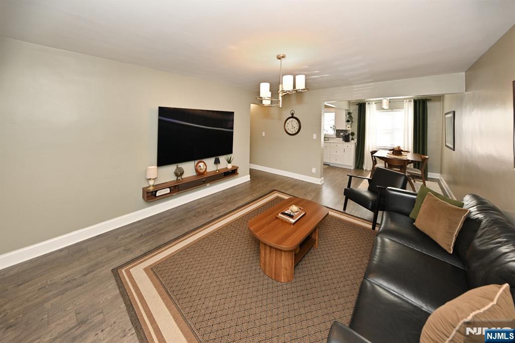 483 Colonial Terrace, Unit 9 Hackensack, NJ 07601 - Photo 4 of 25 a living room with furniture and a flat screen tv