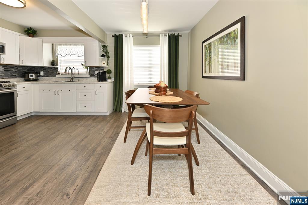 483 Colonial Terrace, Unit 9 Hackensack, NJ 07601 - Photo 5 of 25 a kitchen with a sink cabinets and wooden floor