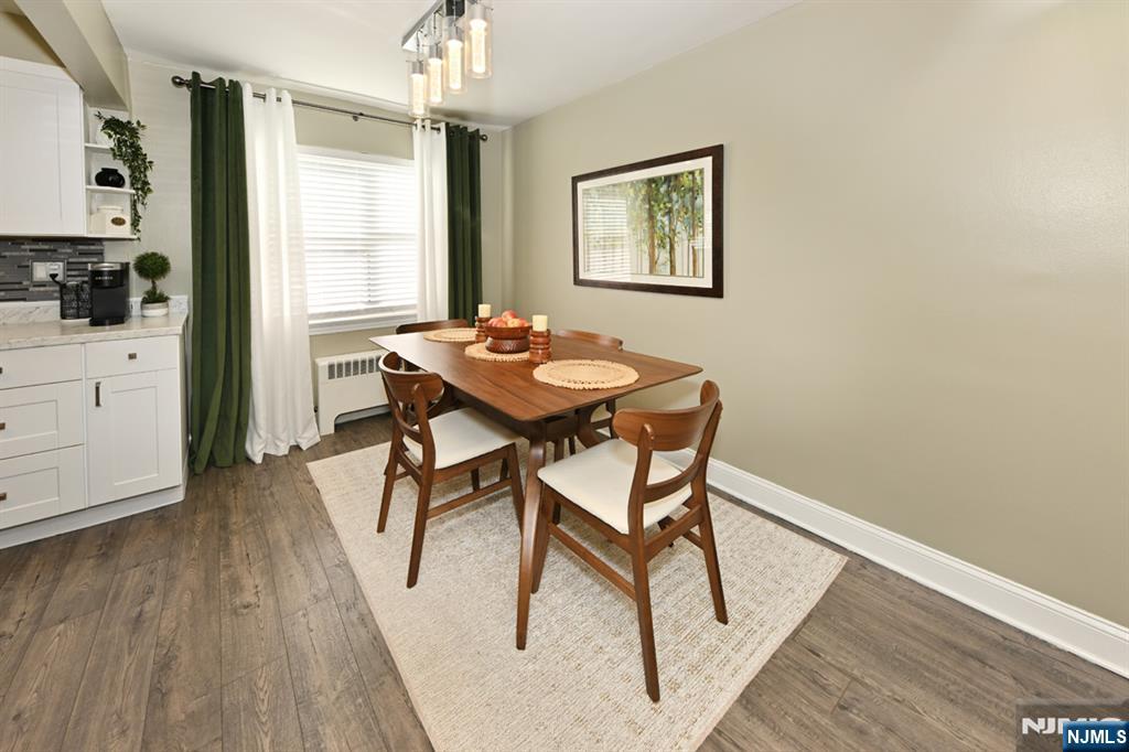483 Colonial Terrace, Unit 9 Hackensack, NJ 07601 - Photo 7 of 25 a view of a dining room with furniture and wooden floor