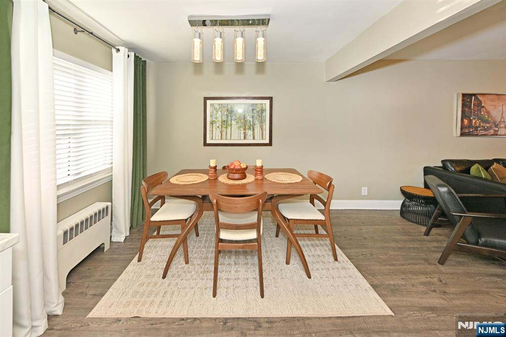 483 Colonial Terrace, Unit 9 Hackensack, NJ 07601 - Photo 8 of 25 a view of a dining room with furniture and wooden floor