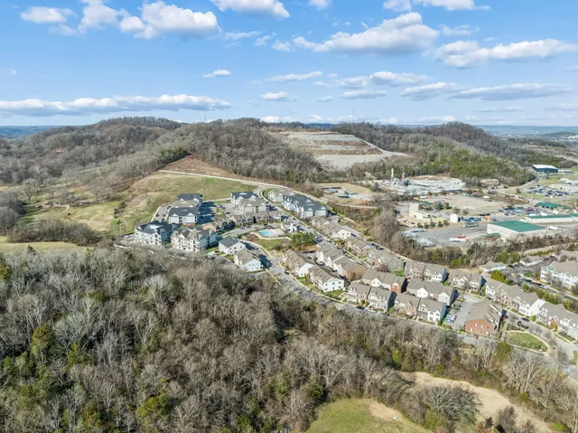 an aerial view of a house with a ocean view