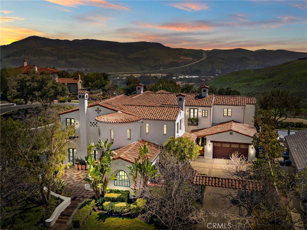 an aerial view of a house with a garden